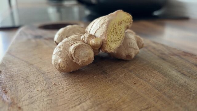 Fresh Ginger Root Close Up on Wooden Kitchen Table for Cooking