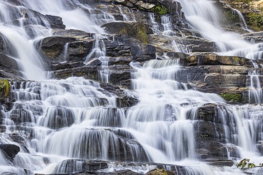Mae Ya waterfall with cascading flowing water, near Doi Inthanon National Park, Chiang Mai Province, Thailand