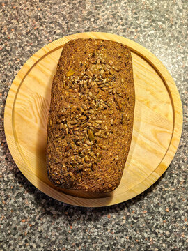 Whole Keto Seed Bread Loaf on Wooden Board