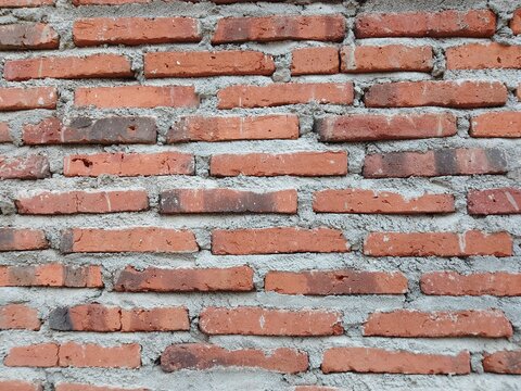 Red Brick Wall Texture Background with Cement Mortar Pattern for Construction and Architecture