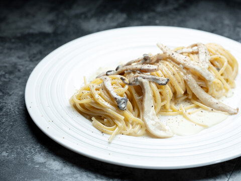 Pasta with mushrooms and cheese on a plate