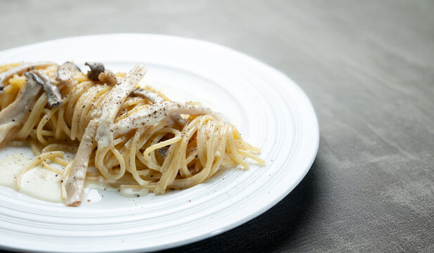 Pasta with mushrooms and cheese on a plate