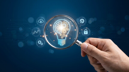 Fototapeta premium Hand holding magnifying glass focusing on glowing brain and gear lightbulb, artificial intelligence, Digital innovation and machine learning research concept.