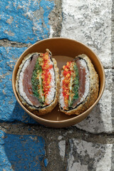 Sushi burger on road markings. Delivery box. Art photo © Cavan