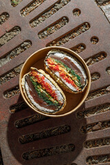 Sushi burger on a metal wire rack. Delivery box. Art photo © Cavan
