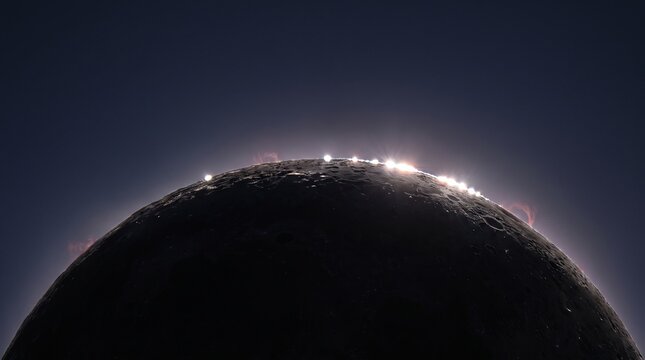 Bailys beads shining through lunar craters during total solar eclipse