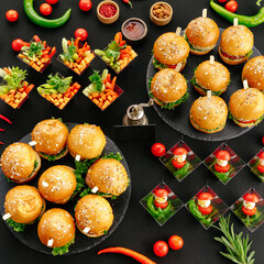 Naklejka na ściany i meble Catering spread of mini burgers and appetizers
