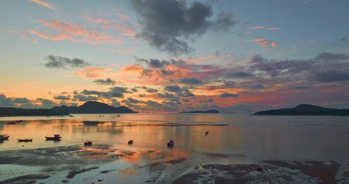 Aerial view of stunning sky above the fishing boat in sunrise. 
scene of colorful sky in sunrise at Rawai beach Phuket. amazing sky texture, abstract nature background.