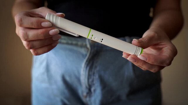 Female abdomen and peptide pen as weight management concept