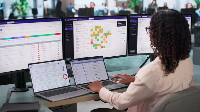 IT Manager Reviewing Risk Dashboard On Laptop