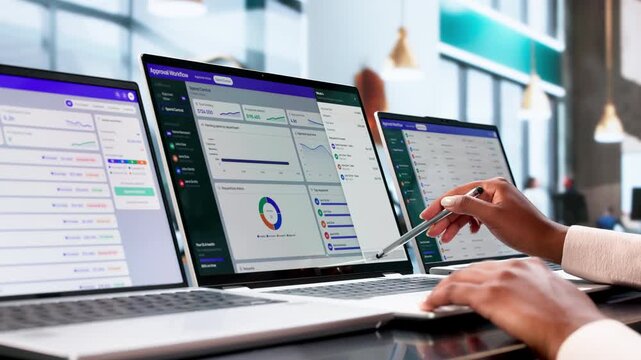 Procurement Manager Reviews Approval Workflow On Laptop