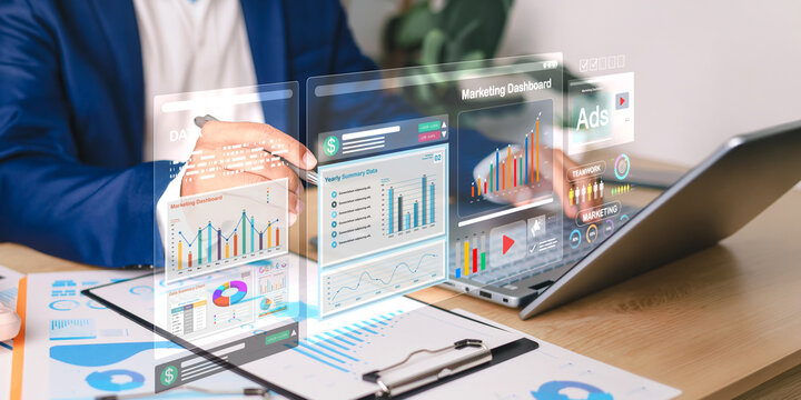 Marketer analyzing digital ads and performance data on a futuristic marketing dashboard UI layered over a laptop screen.