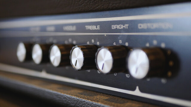 Guitar amplifier control panel with tone knobs