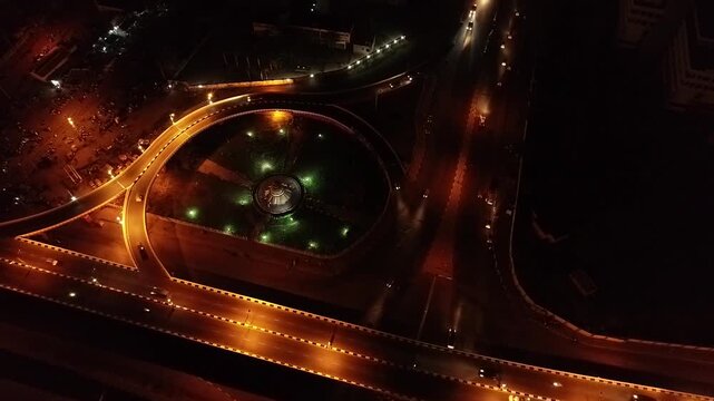 The Kano City Gate Interchange glows after dark with bright roadway lights flowing traffic and a striking display of modern urban infrastructure in northern Nigeria.