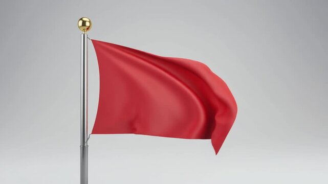 Waving Red Flag on Pole with Golden Finial Against Gray Background Subtle Movement