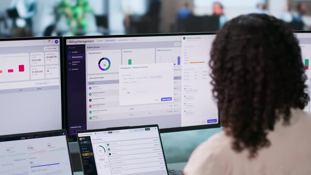 Software Manager Analyzing Subscription Billing Data On Laptop