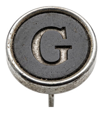 extreme close-up of a vintage typewriter key with the letter g