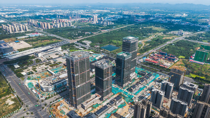 Fototapeta premium Aerial view of high-rise buildings under construction in a newly developed urban district
