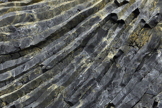 Intricate texture of volcanic basalt columns on Reynisfjall mountain Iceland