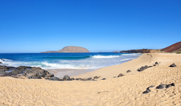 Volcanic beach Playa De Las Conchas with Montana Clara, Island La Graciosa, Lanzarote, Canary Islands, Spain, Europe.