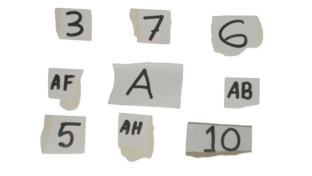 Scattered gray tiles with numbers and letters