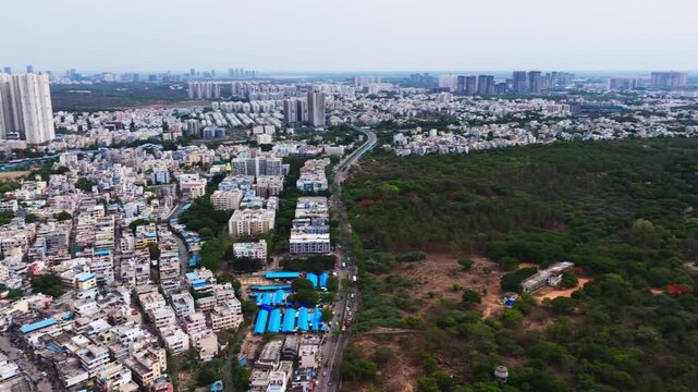 Aerial view of BHEL township with Serilingampalle, Tellapur, residential buildings and skyline at hyderabad, telangana, india. day time, semi circle shot, drone shot, 4k.