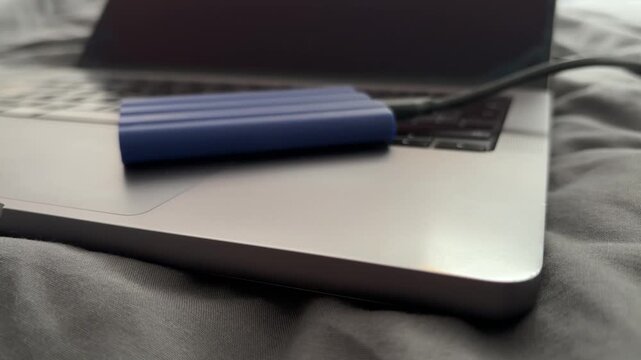 External SSD Connected to Laptop for File Backup and Portable Storage