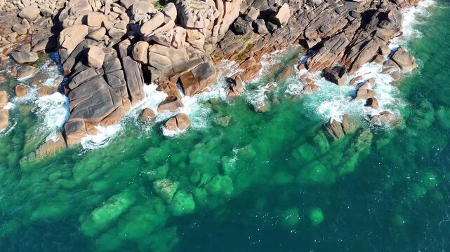 Overhead birds eye drone aerial Waves Pink Granite coast France turquoise sea