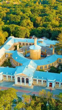 Vertical video. Yessentuki, Russia. Upper baths. Resort park. Park of Culture and Leisure. Sunset time. Drone footage, Point of interest. Rich colors