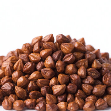 Heap of Raw Roasted Brown Buckwheat Groats on White Background