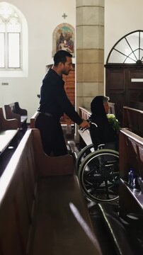 Family, church and woman in a wheelchair with flowers for memorial service, widow and ceremony. Funeral, man or senior person with disability in chapel for christian religion, mourning or bereavement