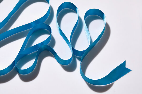 Blue ribbon on white background