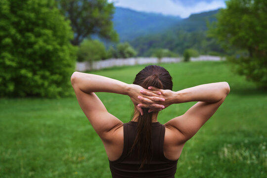 Woman stretches her body during outdoor yoga practice in nature