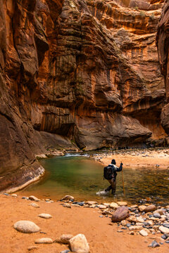 Woman wading The Narrows of Virgin River