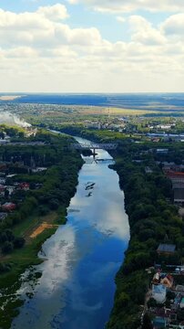 Vertical video. Yelets, Lipetsk region, Russia. Sosna river. Pig-iron bridge. Drone footage. Rich colors