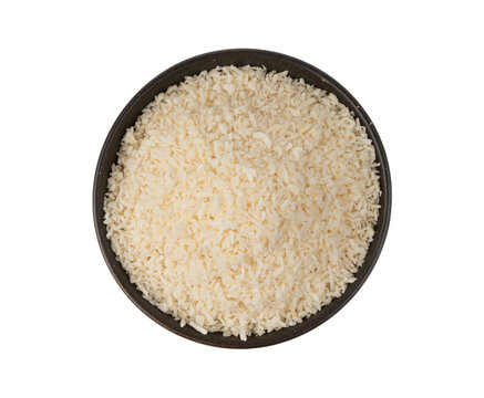 Grated coconut powder. Dry coco flakes pile, shredded desiccated coconut, tropical fruit chips