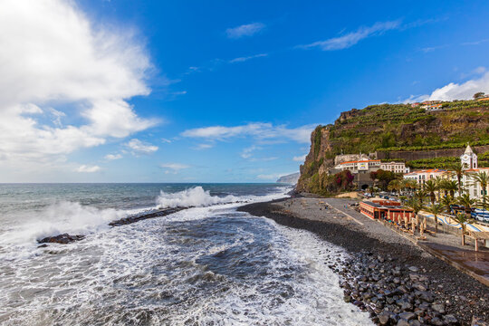 Heavy waves crash on the pebble beach of Ponta do Sol in Madeira