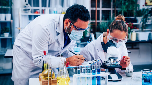 Scientist or researchers working in science laboratory, medical technology research work, science laboratory research and development concept.