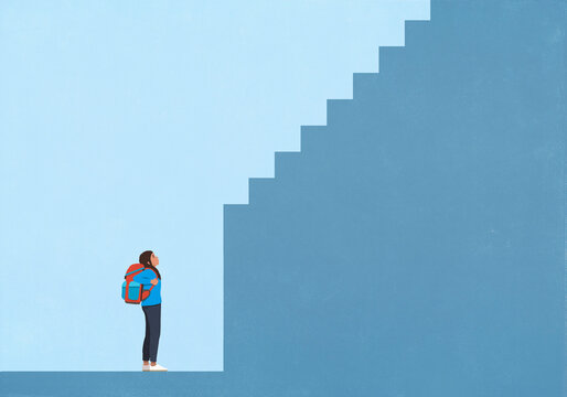 Young woman with backpack looking up at staircase out of reach