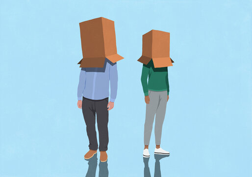 Couple standing with cardboard boxes covering faces against blue background