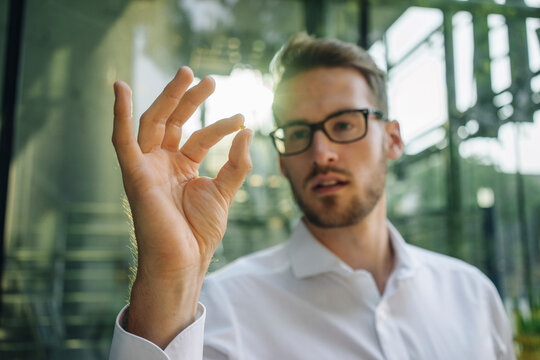 Businessman holding small star in his hand