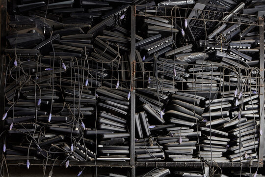 Old computer keyboards in storage of recycling plant