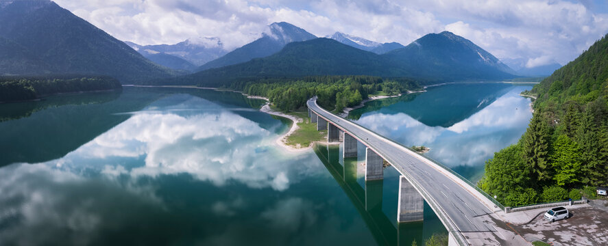 Germany, Bavaria, Sylvenstein dam and bridge with the Alps in background