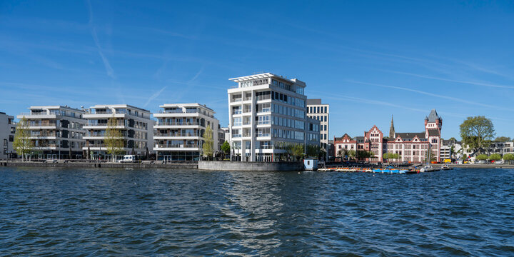 Modern building and castle at lake Phoenix See in Dortmund