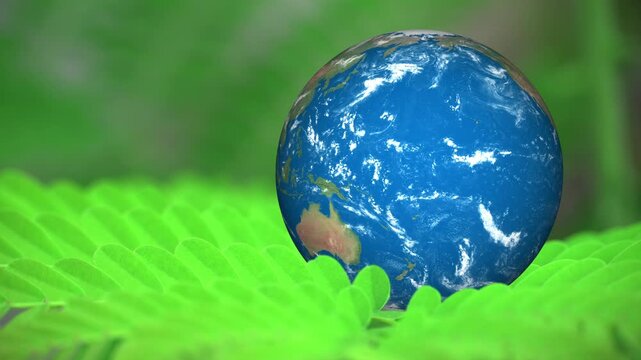 Minimalist conceptual image of an Earth map onto a natural green leaf texture. Represents global sustainability, nature conservation, eco-friendly lifestyle, and bio-energy. Features