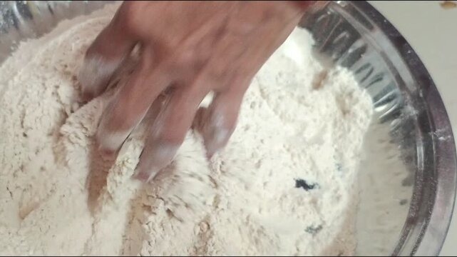 Kneading Dough by Hand - Indian Woman Preparing Wheat Flour Dough for Chapati in Plate