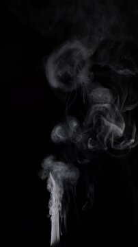 White Smoke Plume Rising. A dense white smoke jet expands into swirling clouds on black.