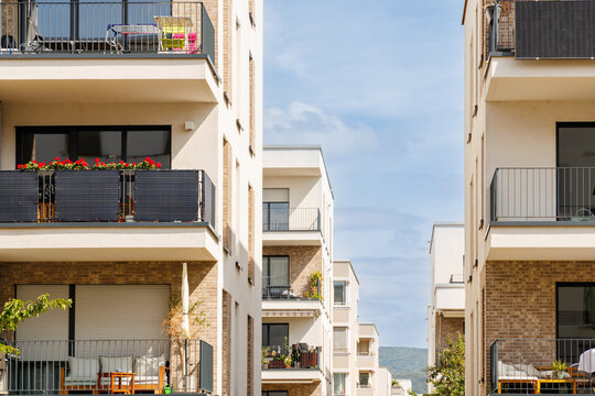 Buildings with balconies in a residential area during daylight hours