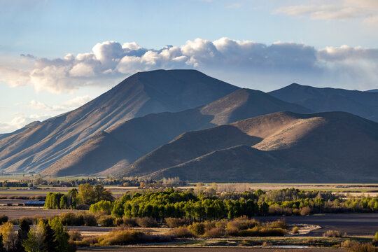 Clouds over barren Bell Mountain