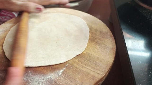 Rolling Roti Dough on Wooden Board - Indian Woman Making Chapati with Rolling Pin